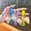 Llavero creativo de concha pequeña con aceite, lindo colgante pequeño de arena movediza líquida, accesorios para bolso, pequeño colgante de regalo, venta al por mayor