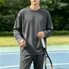 Camiseta casual versátil de manga larga para hombre para otoño, cuello redondo, color liso moderno, cómoda, transpirable y de corte holgado.