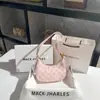 Comércio exterior atacado nicho bolsa rosa axila feminina verão 2022 nova moda Tongqin bolsa de ombro baguete francesa Crescente