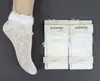 Calcetines tobilleros de malla transparente de lunares estilo princesa Lolita con lazo, calcetines de media pantorrilla al por mayor para niñas