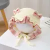 Bonitos y adorables gorros de otoño e invierno para niños, con diseño de poner, material de punto y una serie de dibujos animados, que brindan abrigo y protección para los oídos para bebés y niños pequeños.