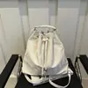 Bolsa pequena texturizada personalizada feminina 2024 outono nova bolsa de ombro única bolsa de axila design de bolsa balde mochila de trabalho