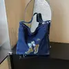 Bolso de hombro moderno y a la moda 2026 nuevo vintage versátil de gran capacidad bandolera para estudiantes, para ir al trabajo y para viajar bolso de mano