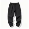 Pantalones Casuales de Sarga para Hombres y Mujeres Primavera y Otoño Pantalones Deportivos Sueltos Versátiles de Moda Tendencia Pantalones de Chándal Pernera Ajustada Hacia Abajo Dobladillo Harem