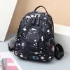 2024 nueva tela de nylon casual artística para ir al trabajo simple personalidad color caramelo mochila bolsa de mujer venta directa de fábrica