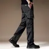Calças Masculinas Workwear à Prova de Três Casual Calças Masculinas de Perna Reta Tamanho Plus Calças Corta-vento Soltas Versáteis Multibolsos Calças Compridas
