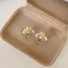 Aretes de flor de circonita cúbica retro estilo francés, un diseño lujoso y sofisticado con un toque de elegancia, creando un look único y elegante