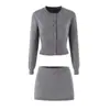 Ropa de mujer transfronteriza 2026 Moda europea y americana casual ajuste ceñido suéter de punto francés + conjunto de falda corta para mujer M11885