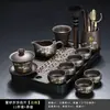 Juego de té de arcilla púrpura con diseño de bambú dorado, que incluye una tetera y tazas de servicio para uso doméstico, con un asa para prevenir quemaduras y asegurar la distribución uniforme del té