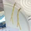 Brincos Longos com Corrente Cruzada e Borla Nós Estilo Hong Kong Retrô para Mulheres Europeus Americanos Exagerados Simples Design de Nicho Ornamentos de Orelha