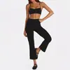 Conjunto de dos piezas para mujer estilo europeo y americano, con tirantes finos y pantalones acampanados cropped de cintura alta, sensación nude, fitness casual para correr, venta al por mayor