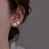 Mini Pendientes Creativos de Pata de Gato Amanecer de Primavera para Mujer 2026 Nueva Tendencia Lindos Tachuelas Asimétricas de Oreja de Gato