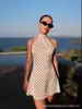 Vestido retro de lunares estilo francés con cuello halter y espalda descubierta para mujer, nueva colección de otoño, vestido corto de línea A de alta gama que ciñe la cintura