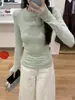 Foto real de la nueva camiseta de manga larga de color liso con cuello redondo de estilo coreano para otoño e invierno, con diseño de ojal en la manga, elegante y versátil, para mujer 19575