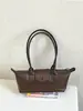 Bolso tote de estilo francés con nicho y asa larga, nuevo diseño de moda, bolso baguette de alta calidad, moderno y versátil, perfecto para llevar debajo del brazo