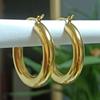 Pendientes de anillo liso brillante de acero inoxidable, venta al por mayor, pendientes de temperamento simple, joyería de acero de titanio de moda europea y americana para mujer, exclusiva transfronteriza