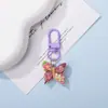 Llavero colgante de resina de color caramelo simulación de mariposa DIY accesorio de llave con cuentas de dibujos animados decoración creativa para bolsa