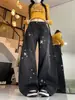 Jeans feminino retro americano com estampa de estrelas e barra curva, design de rua de verão, calça longa larga e solta com caimento.