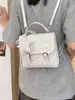 Mochila de mujer con estampado de estrellas transfronteriza 2026 nueva moda moderna bolso de mano versátil mochila mini para estudiante de viaje