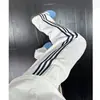 Calça de moletom cinza da moda outono/inverno estilo americano com três listras para homens e adolescentes, forrada com fleece, perna reta, calça atlética casual