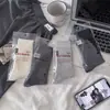 26 Estilos Nuevos de Calcetines para Mujer de Zhuji, Color Sólido de Doble Aguja con Etiqueta Sencilla, Calcetines Holgados Versátiles de Moda hasta la Pantorrilla para Primavera y Verano