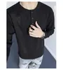2026 Nova Camiseta Casual Masculina de Manga Longa Waffle Solta Cor Sólida com Capuz Versátil Decote V Casual