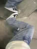 Jeans de microcampana lavados con estampado de rayo para hombre, primavera y otoño, pantalones largos casuales rectos de pierna ancha de la alta calle americana