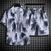 Comercio exterior artículo de stock camisa floral hawaiana hombre manga corta holgada talla grande conjunto de playa pareja estilo Hong Kong retro moderno pantalones cortos