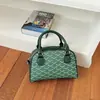 A bolsa quadrada pequena popular de estilo coreano para mulheres deste ano é o novo modelo de verão de 2026 com um elegante padrão xadrez, adequada para o trabalho e como bolsa de ombro ou transversal.