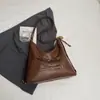 Bolsa de ombro única de cor sólida com nova textura transfronteiriça, bolsa de axila, mochila de grande capacidade moderna, bolsa tote alta e estilosa
