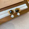 Pendientes de borla con carcasa de madera marrón transfronterizos europeos y americanos, pendientes de estilo vintage Maillard, pendientes de mujer de lujo ligero de alta gama