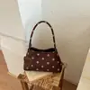 Bolsa de ombro retrô com poá estilo francês para mulheres, nova bolsa de mão de ombro único para o verão de 2026, simples e estilosa para o dia a dia, design de nicho
