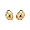 Pendientes de botón estilo metal minimalista transfronterizos europeos y americanos, pequeños y delicados, pendientes versátiles con un toque de lujo ligero y alta gama