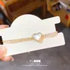 Pulsera Geométric Ovalada de Imitación de Concha con Corazón de Circonia Europea y Americana Chapada en Oro Real de 18K Joyería de Mano Elegante de Nicho de Gama Alta para Mujeres
