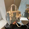 Bolsas Texturizadas de Moda para Mujer Este Año 2026 Bolsos Cruzados de Nicho de Verano con Diseño Elegante y Bolsos de Mano Tipo Cubo a la Moda
