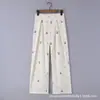 Conjunto de dos piezas para mujer en verano: top tipo camisola ajustado con estampado de cerezas y volantes, estilo callejero americano, chica atrevida, y pantalones largos de pierna ancha.