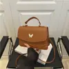 Bolsa Pequena Texturizada Casual Retrô Tendência 2025 para Mulheres, Nova Bolsa Quadrada Pequena Estilosa de Ombro Transversal Borboleta de Nicho