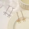 Pendientes Largos para Mujer Estilo Ins con Borla y Lazo, Metal Brillante con Diamantes, Elegantes y Encantadores, Venta Caliente Transfronteriza Europea y Americana