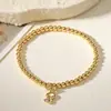 Nuevo Producto Transfronterizo Aogu: Pulsera Minimalista y Única de Cobre con Baño de Oro de 18 Quilates, Incrustación de Circonia y Dijes de Corazón, Ojo y Libélula