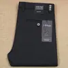Pantalones casuales lisos de algodón elástico de fibra de poliéster grueso para otoño e invierno, de color sólido, para hombre, de oficina, de negocios, brillantes