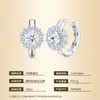 Pendientes de plata S925 transfronterizos superventas europeos y americanos con moissanita, diseño de flor redonda de cuatro puntas, pendientes versátiles de lujo ligero de nicho para mujer