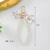 Chaveiro Criativo de Pérola em Forma de Coração Atacado Estilo Coreano Pingente de Bolsa de Pérola em Concha Retrô Pingente de Fone de Ouvido Corrente para Celular