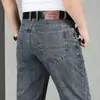 Calça jeans masculina de cintura alta e gancho profundo, Guangzhou Xintang, novo estilo primavera e outono, corte reto solto, versão fina de verão, calça masculina estilo dad