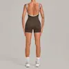 Ropa de yoga aéreo al por mayor transfronteriza, traje de una pieza color block cepillado con diseño de espalda hueca, ropa adelgazante para Pilates y fitness, disponible para dropshipping