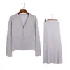 Conjunto de punto calado con pedrería en forma de abanico para mujer, cuello alto, botones de perla, top sin mangas desgarrado, falda de longitud media, moderno conjunto de dos piezas