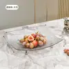 Bandeja de frutas de luxo leve transfronteiriça para uso doméstico na sala de estar, bandeja de frutas de plástico de pé alto para frutas secas e lanches, transparente com base