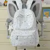 Mochila de moda estilo coreano con estampado de estrellas, una opción elegante y de alta calidad para estudiantes de secundaria y preparatoria, que ofrece una gran capacidad para el uso diario.