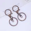 Llavero de aleación de color con cierre de langosta, juego de tres piezas, ocho llaveros, accesorios para joyería DIY, joyería creativa al por mayor