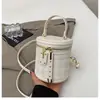 Bolsa de Mão Pladada Nicho Estilo Coreano Bolsa Cilíndrica para Mulheres 2026 Nova Moda Ins Bolsa Saco Bolsa de Ombro Transversal Estilosa