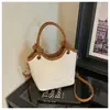 Bolso de mano pequeño de moda transfronterizo para mujer, nuevo bolso cubo de nicho de moda, bolso de hombro cruzado vintage con estampado de leopardo para el trabajo